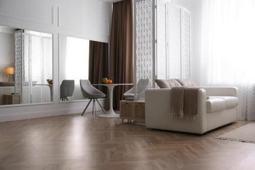 Modern living room with parquet floor and stylish furniture