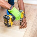 Homeowner discussing flooring plans with contractor in Omaha