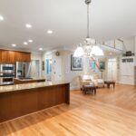 A beautifully furnished room showcasing the elegance and natural beauty of hardwood flooring.