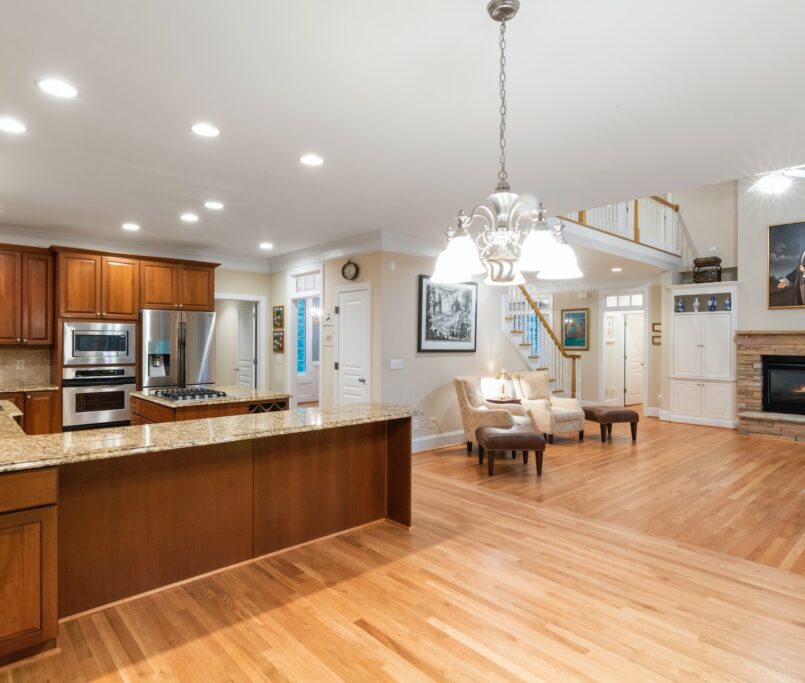 A beautifully furnished room showcasing the elegance and natural beauty of hardwood flooring.