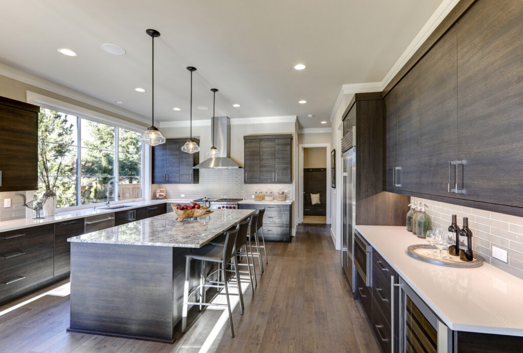 Beautiful modern kitchen with laminate flooring.