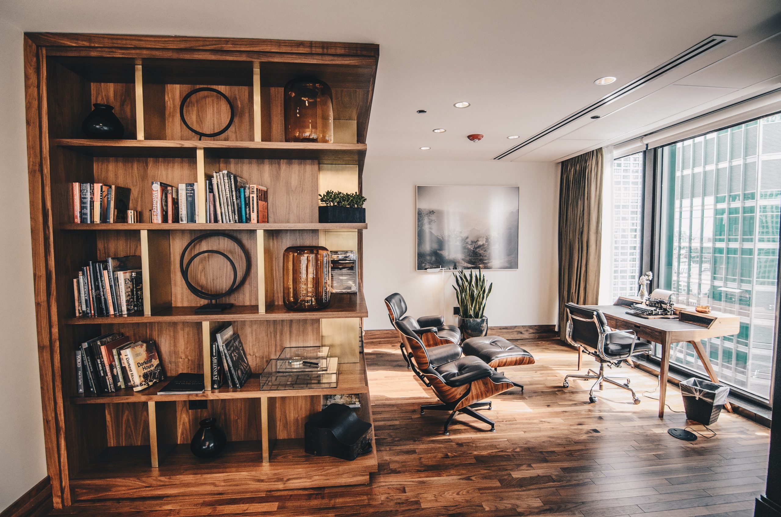 Inviting home library with hardwood flooring